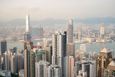 Aerial view of modern buildings in city against sky