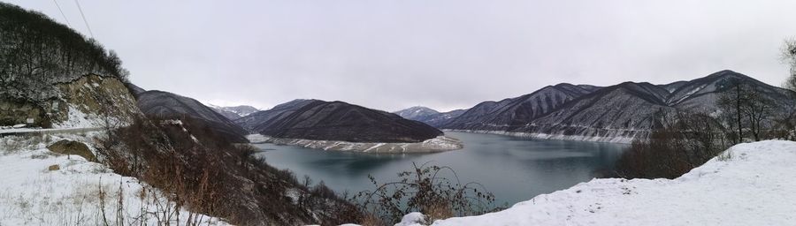 Panoramic view of lake and snowcapped mountains against sky