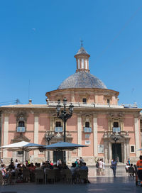 Low angle view of historical building against clear blue sky