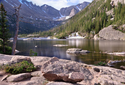 Scenic view of lake and mountains against sky