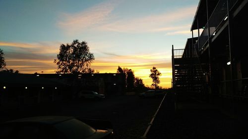 Built structure against sky at sunset