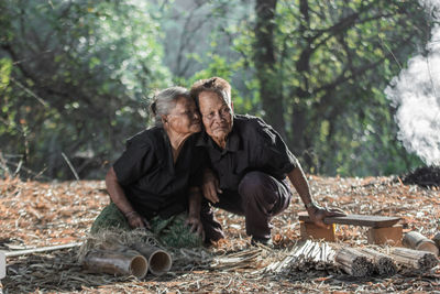 Man with woman in forest