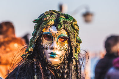 Close-up portrait of woman wearing mask