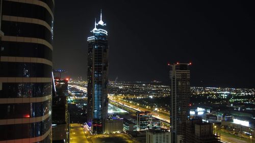 Illuminated buildings in city at night