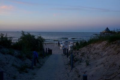 Scenic view of beach against sky during sunset