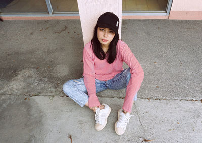 Portrait of girl sitting outdoors