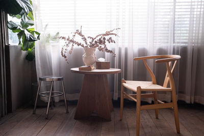 Stylish living room with corner windows with blinds