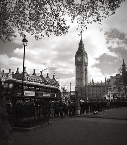 View of cityscape against cloudy sky