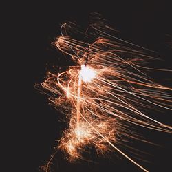 Close-up of illuminated firework display at night