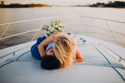 High angle view of woman lying on boat
