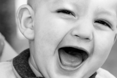Close-up portrait of smiling baby boy