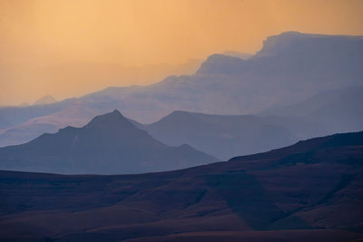 Scenic view of mountains against sky during sunset