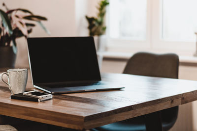 Close-up of laptop on table