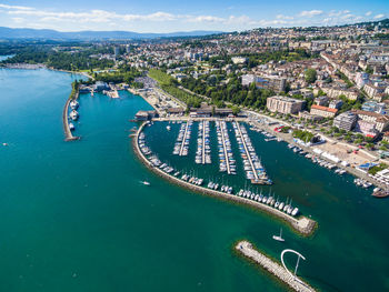 High angle view of sea and buildings in city