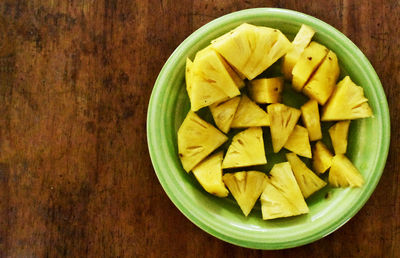 Directly above shot of chopped fruits in bowl on table