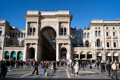 People in front of historical building