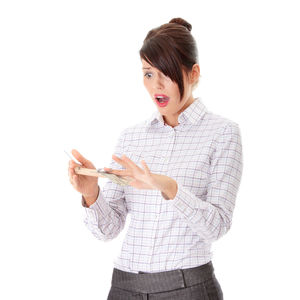 Young woman standing against white background