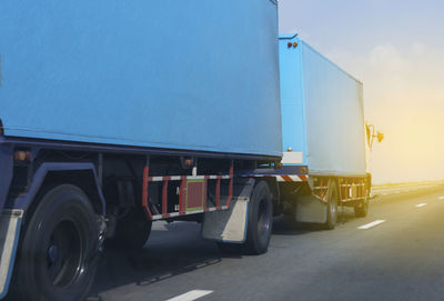 Vehicles on road against the sky