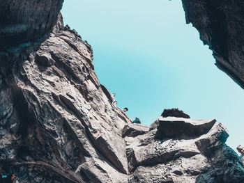 Low angle view of rock formation against sky