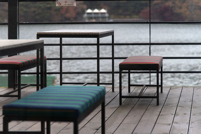 Empty chairs and tables in restaurant