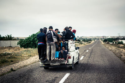 People on road against sky