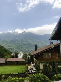 High angle view of houses and trees against sky