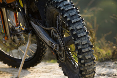 Close-up of motorcycle on field