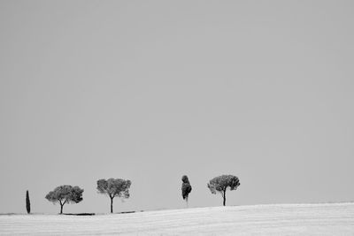 Scenic view of landscape against clear sky during winter