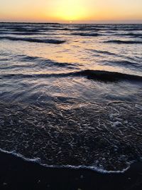 Scenic view of sea at sunset