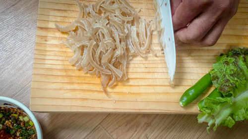 High angle view of chopped vegetables on cutting board