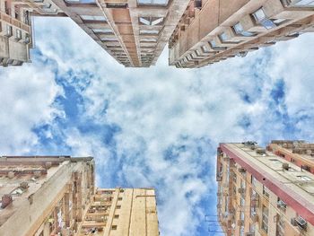 Low angle view of building against cloudy sky