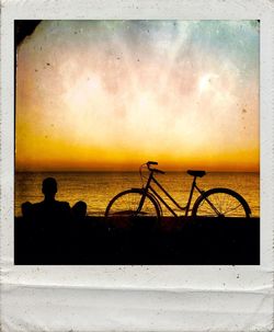 Silhouette of people on beach at sunset