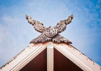 Low angle view of statue against sky