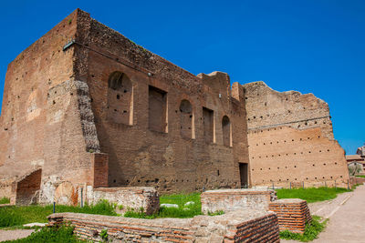 Old ruin building against blue sky