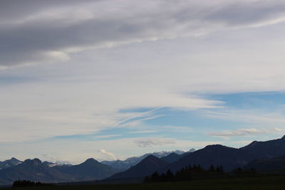 Scenic view of silhouette mountains against sky