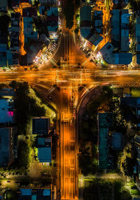 Illuminated city street and buildings at night