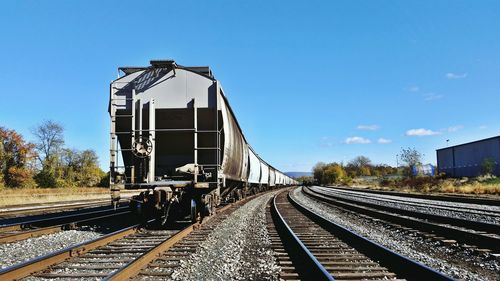 Railroad tracks against clear sky