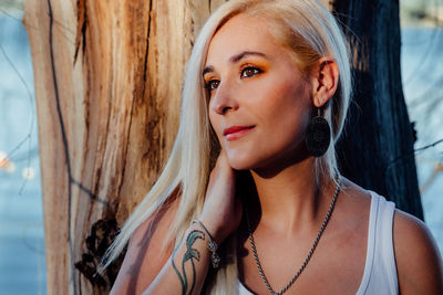 Portrait of beautiful young woman looking away