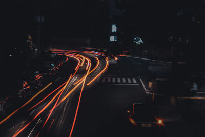 High angle view of light trails on road at night