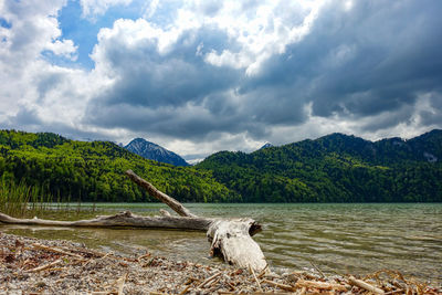 Scenic view of lake and mountains against sky