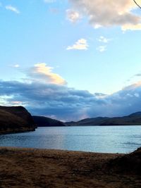 Scenic view of sea against cloudy sky