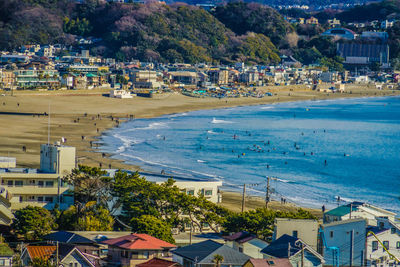 High angle view of townscape by sea