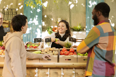 Rear view of woman holding teddy bear