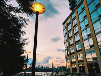 Low angle view of buildings against sky during sunset