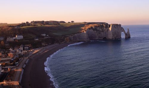 Scenic view of sea against clear sky during sunset