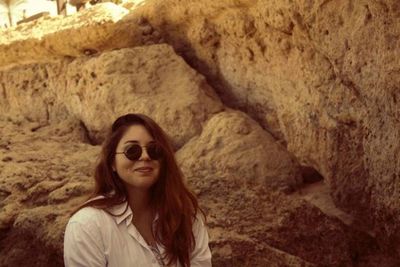 Portrait of young woman in sunglasses