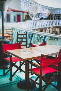 Empty chairs and tables in restaurant