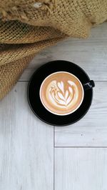 High angle view of cappuccino on table