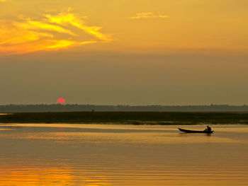 Scenic view of sea at sunset