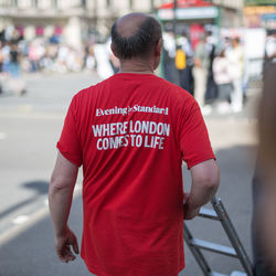 Rear view of man standing on street